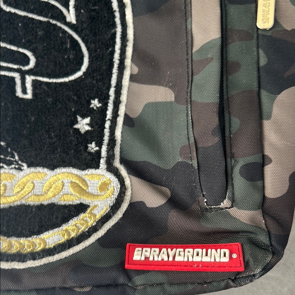 Sprayground Camouflage Backpack with Peace Sign Patch - Picture 2 of 5